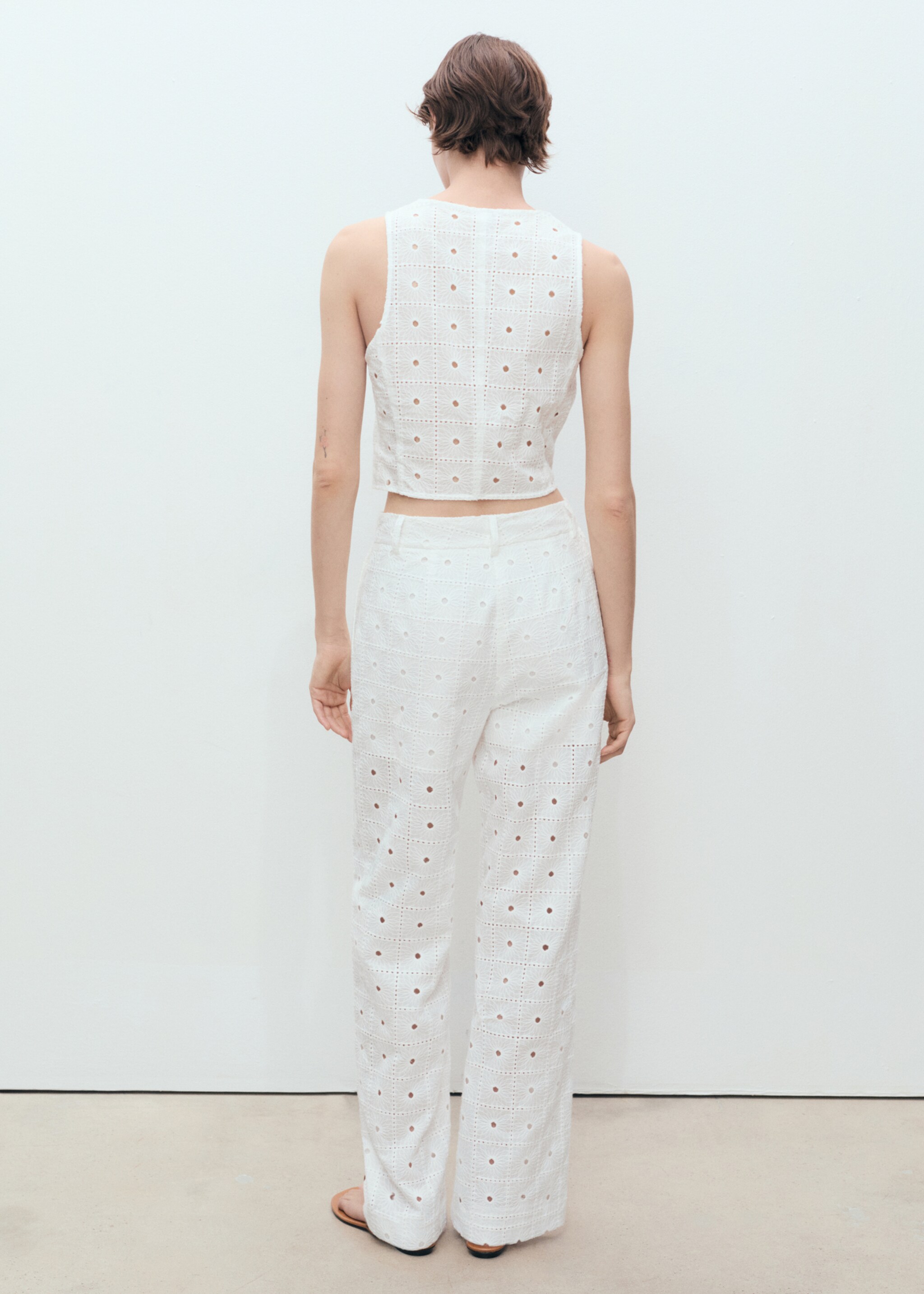 Embroidered cotton waistcoat with bows - Reverse of the article