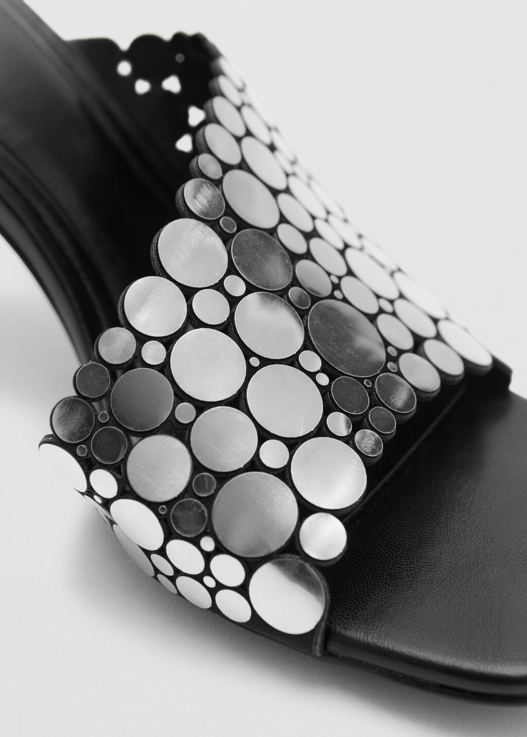 Heeled sandals with metal decorations