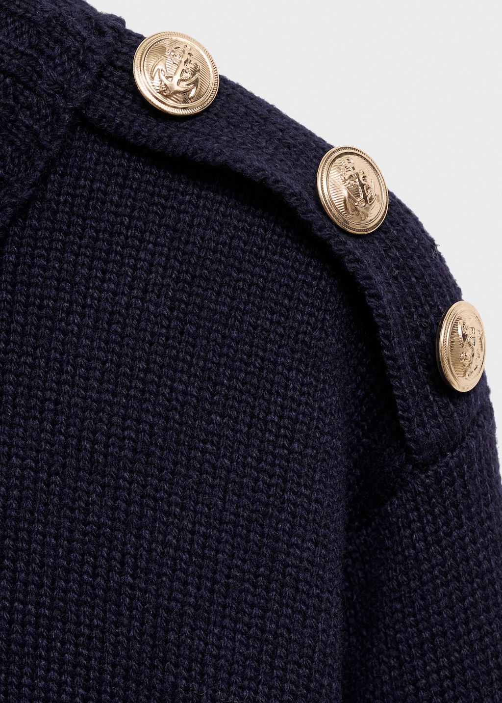 Knitted sweater with jewel buttons
