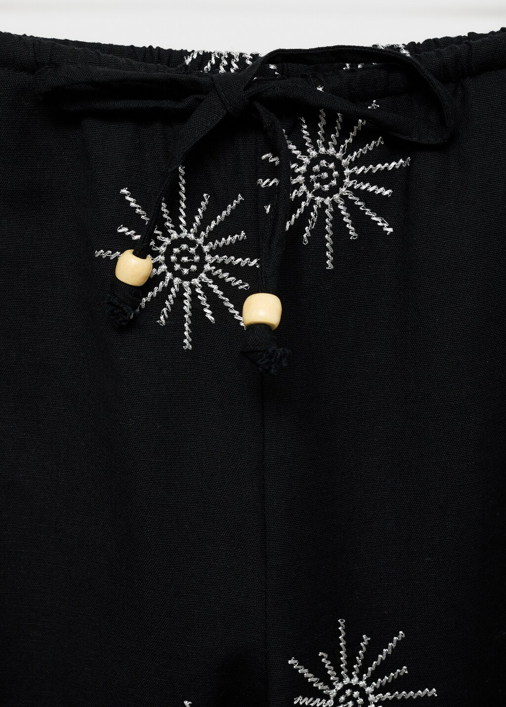 Long pants with embroidered details