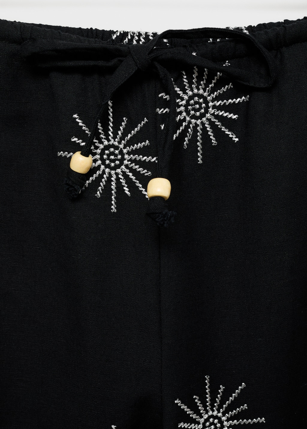 Long pants with embroidered details