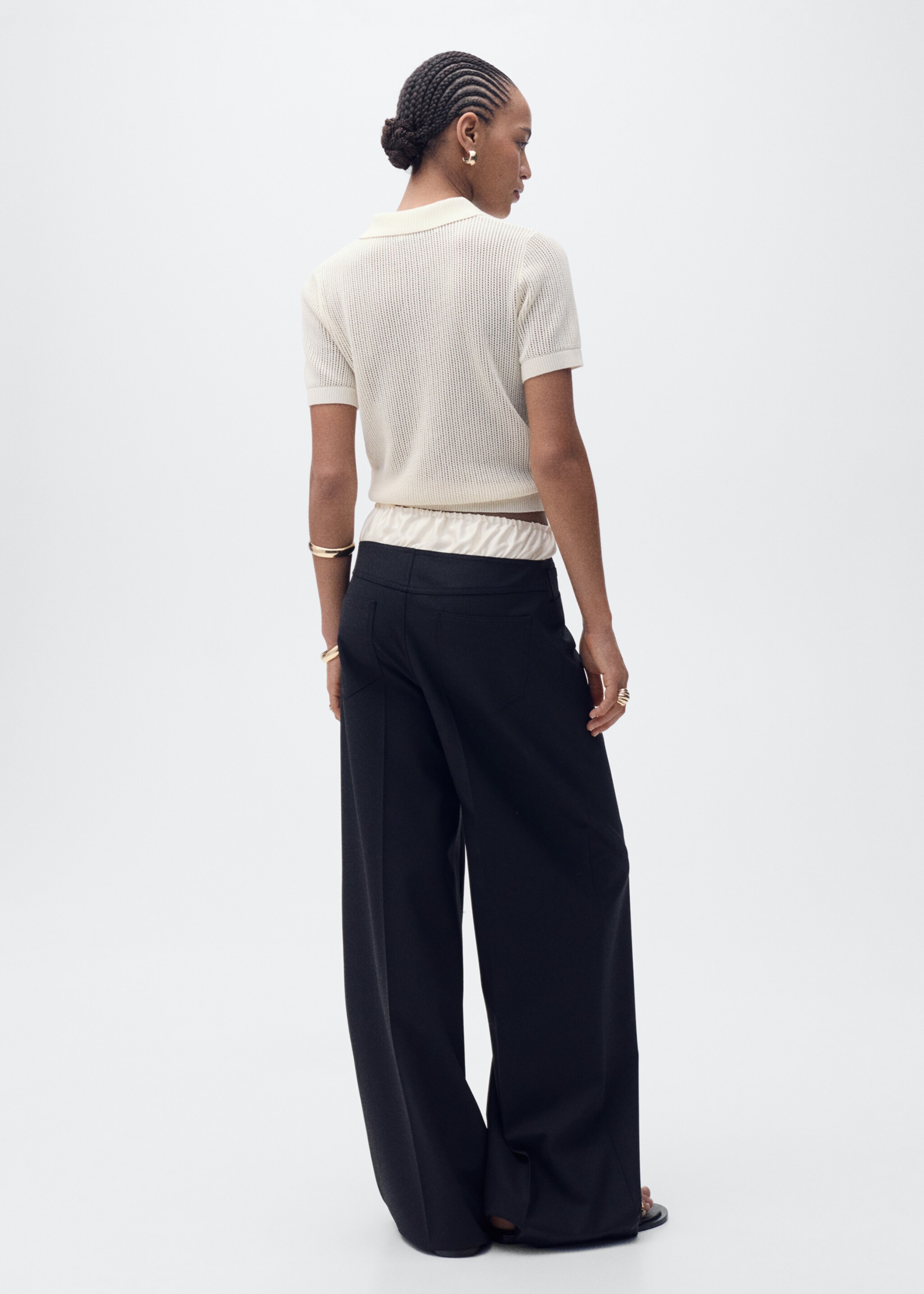 Openwork knitted polo-neck sweater - Reverse of the article