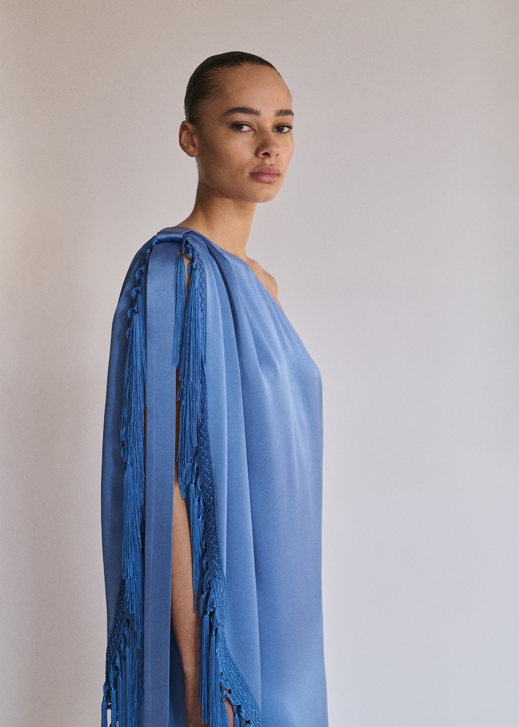 Asymmetrical satin dress with fringes
