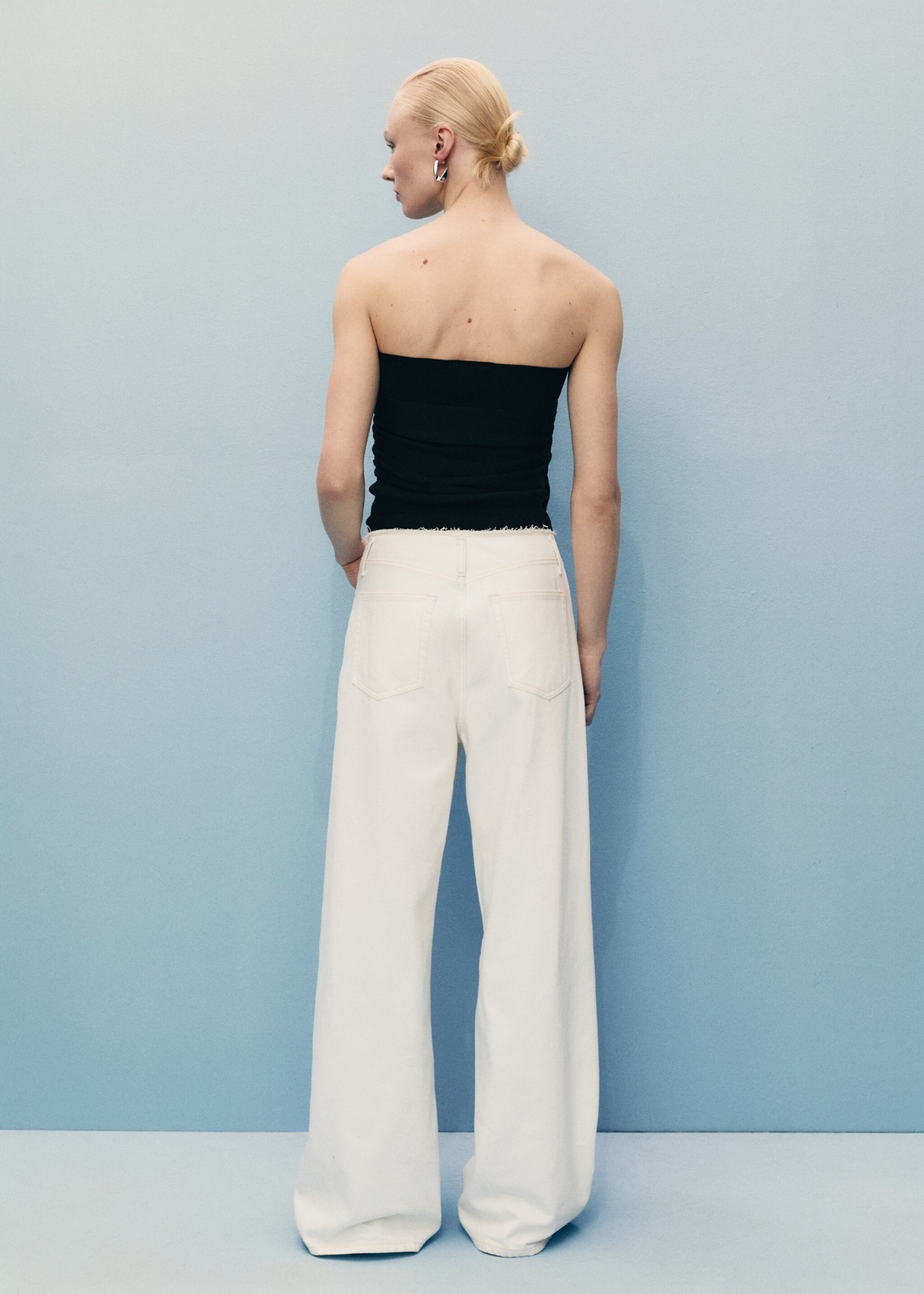 Wide-leg denim trousers with frayed waist - Reverse of the article