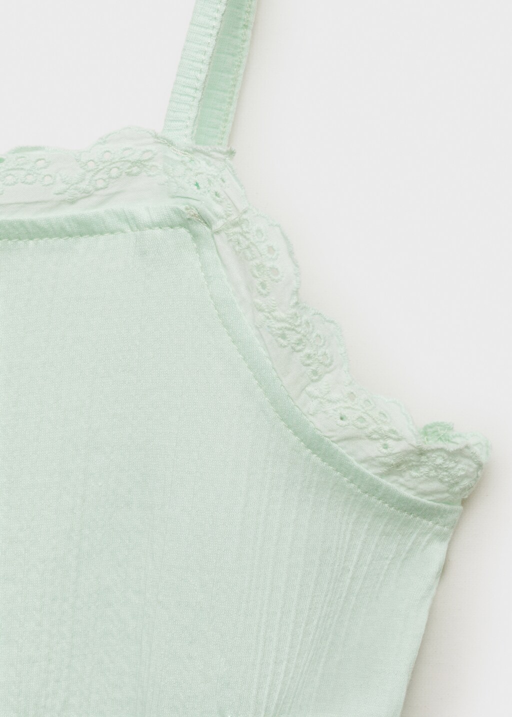 Top with Swiss embroidery detail