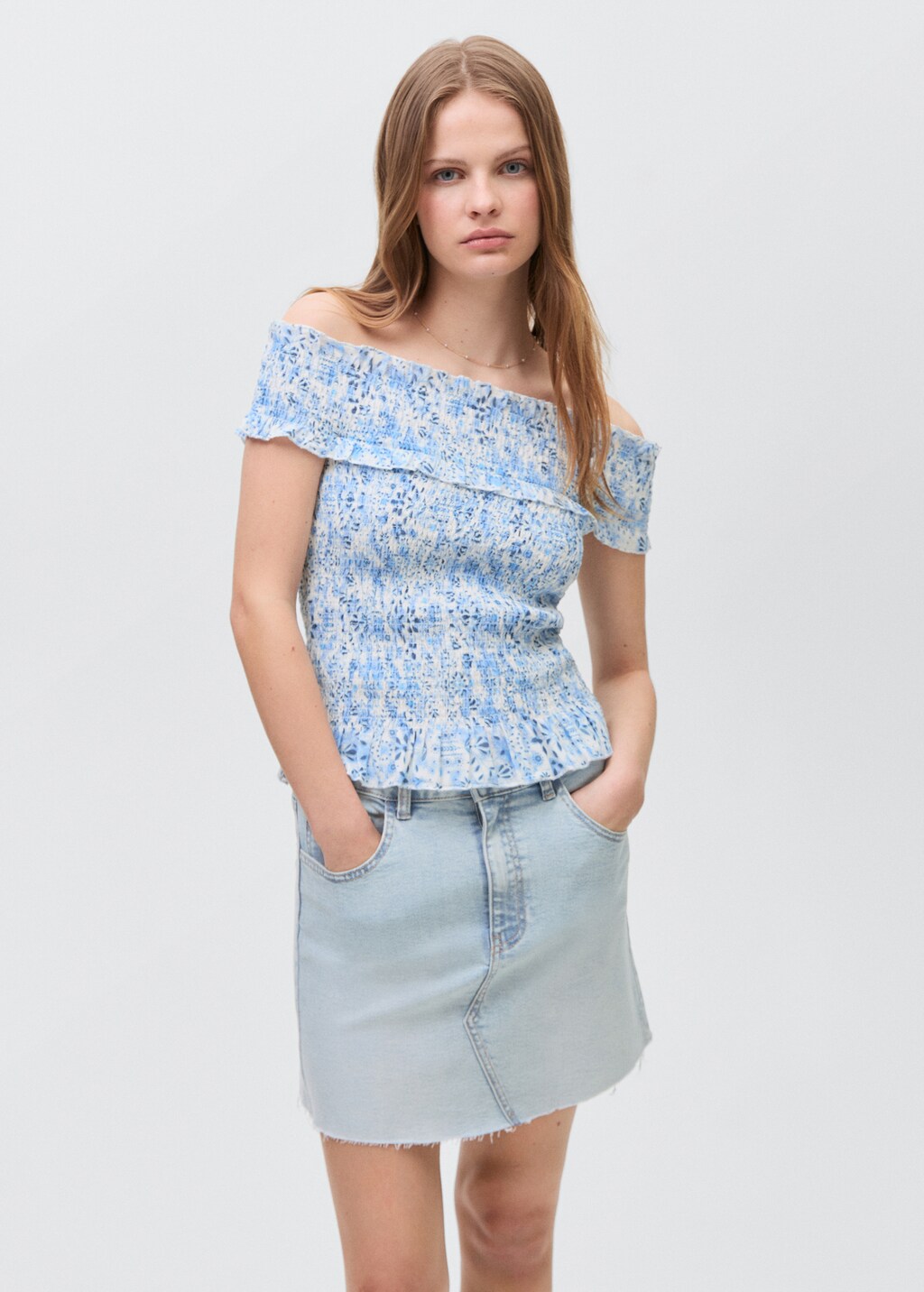 Denim miniskirt with frayed hem