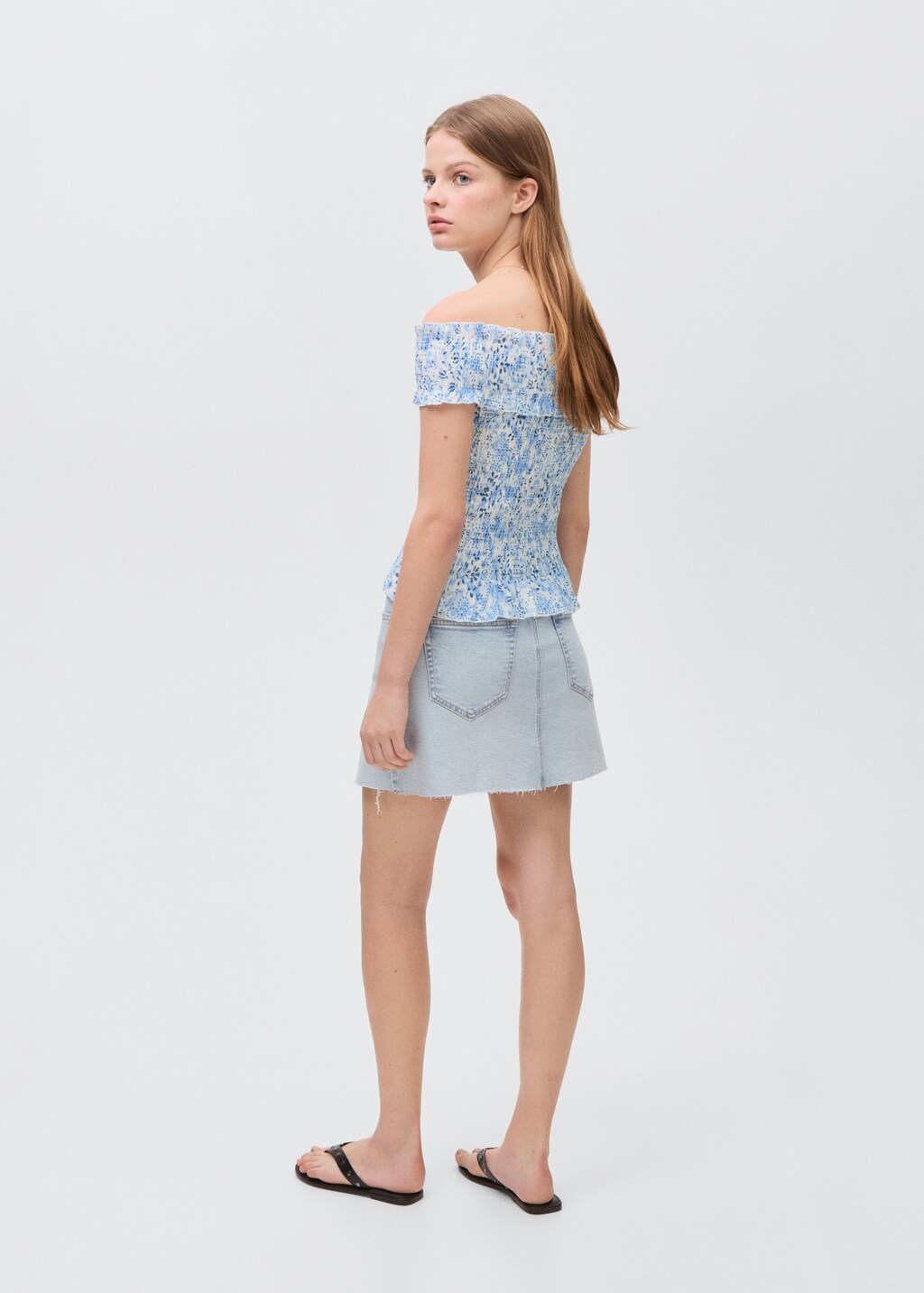 Denim miniskirt with frayed hem