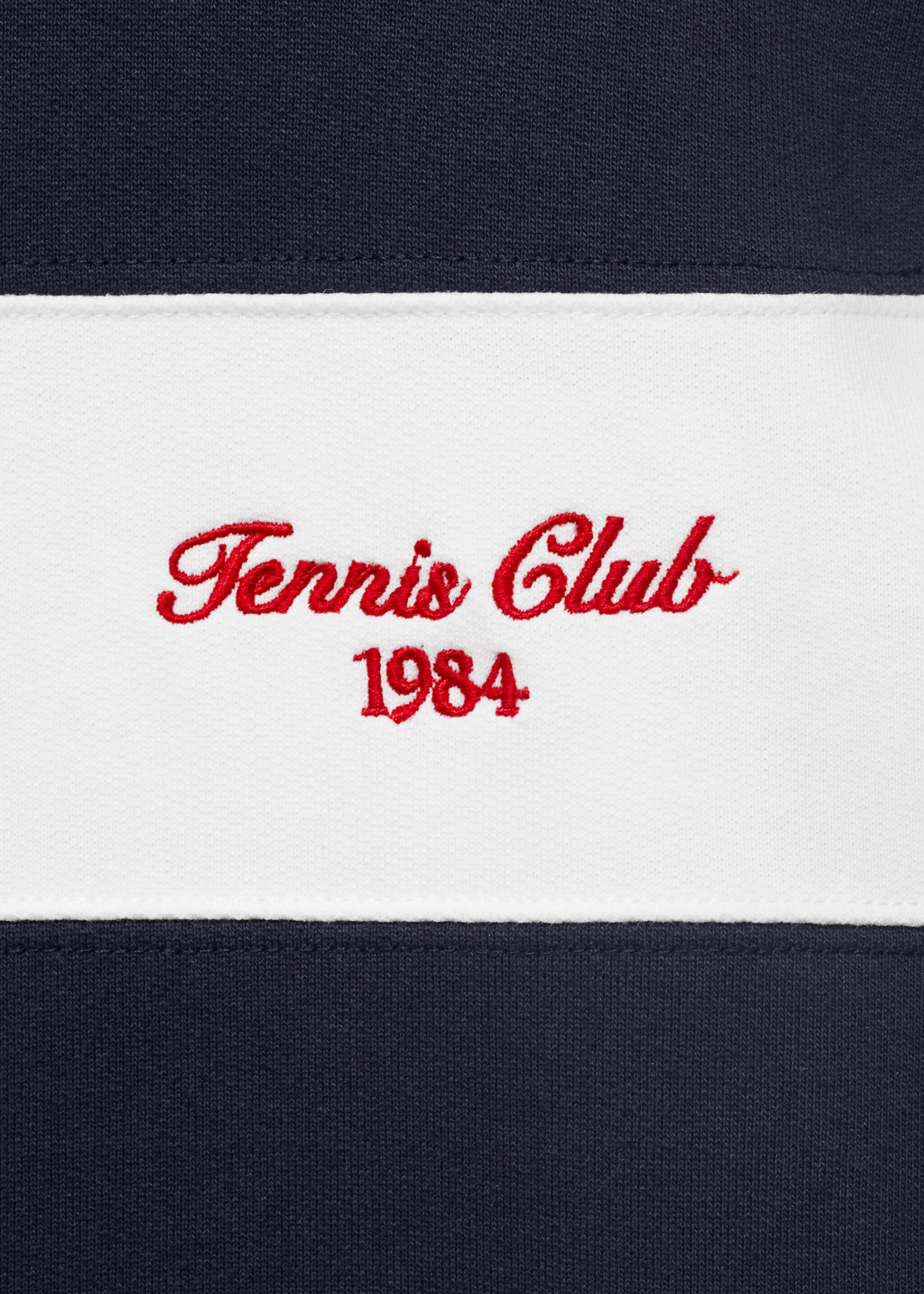 Gestreiftes Poloshirt mit aufgesticktem Schriftzug - Detail des Artikels 0