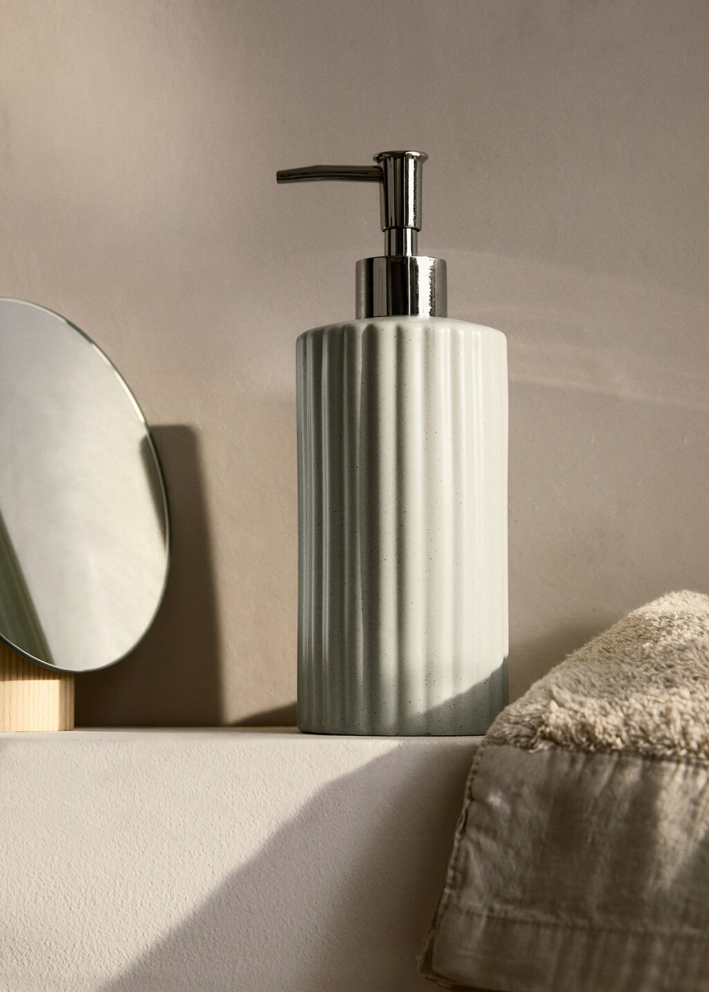 Striped stoneware soap dispenser