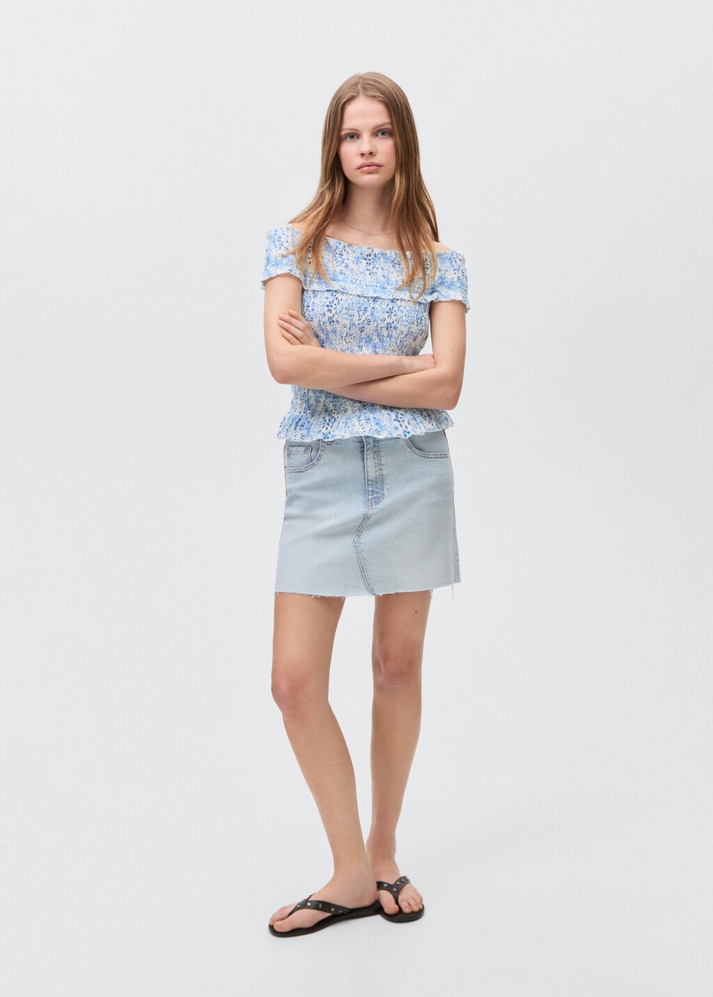Denim miniskirt with frayed hem