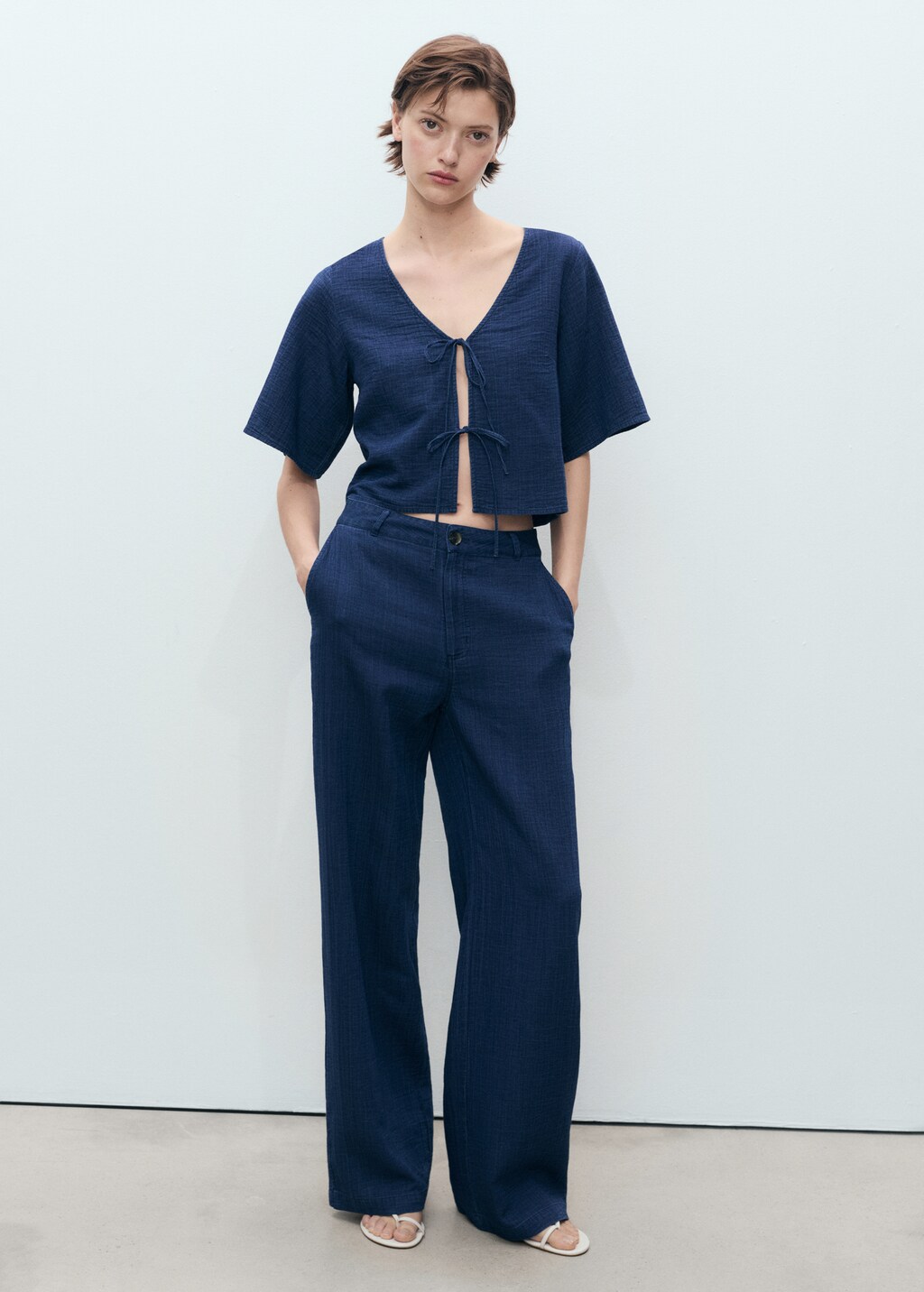 Flowy denim top with bows - Women | MANGO USA