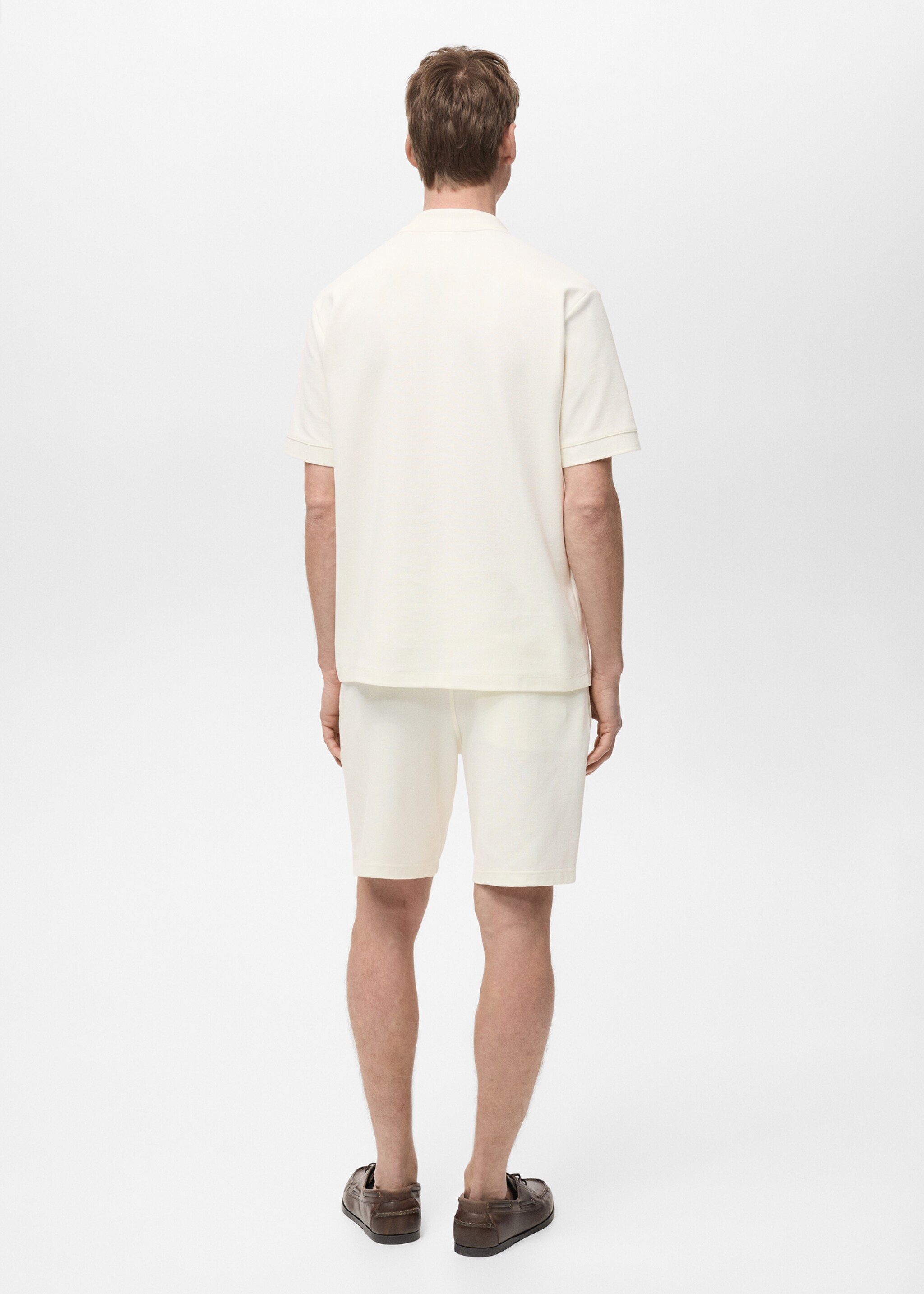 Structured knitted polo shirt - Reverse of the article