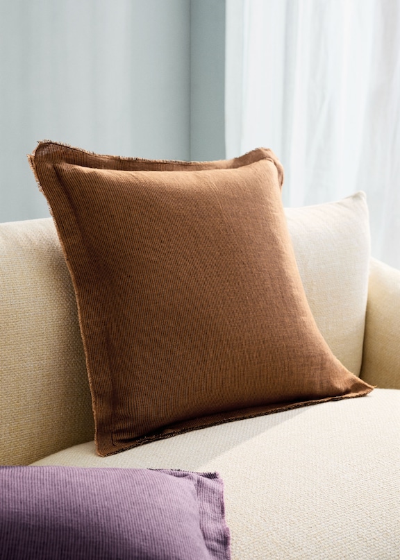 Combination of beige sofa cushions.