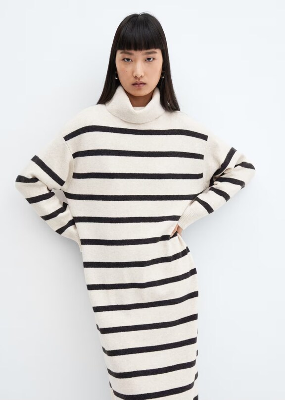 Woman wearing a long knitted striped dress