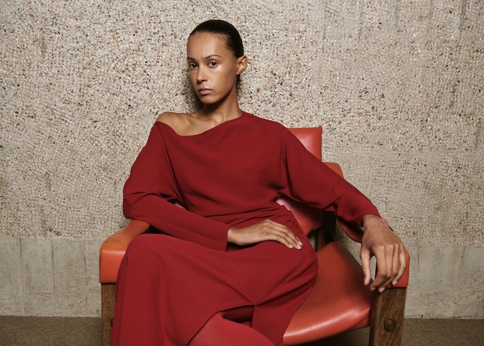 Woman wearing a Valentine's Day outfit with a red dress