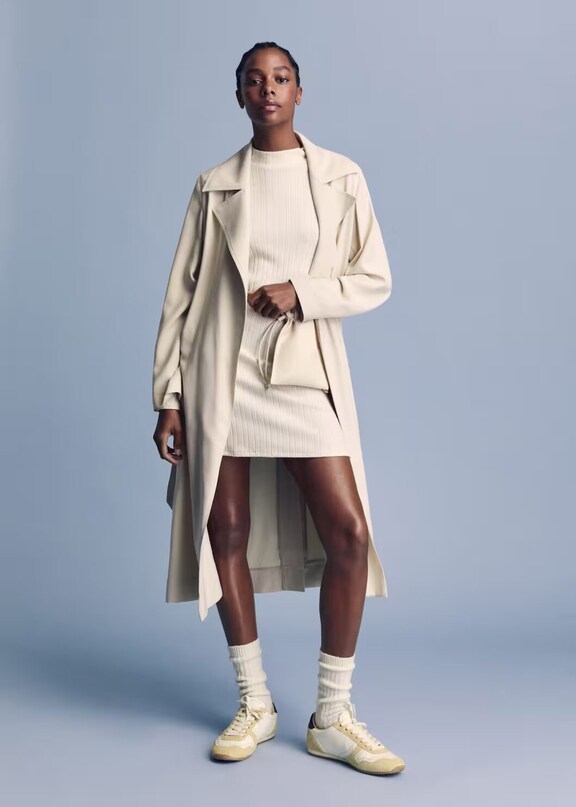 Woman wearing a casual knitted dress look.