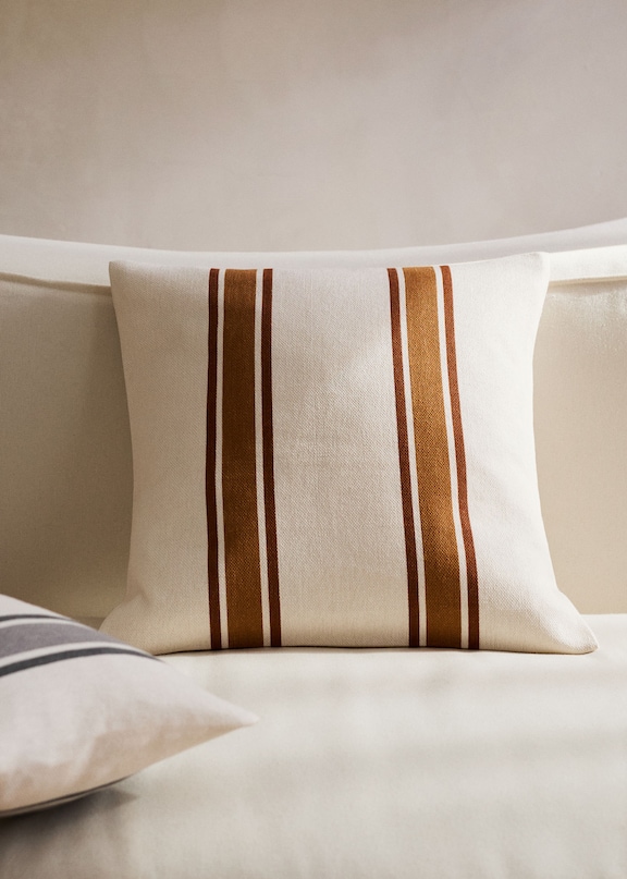 Combine cushions with beige sofa.