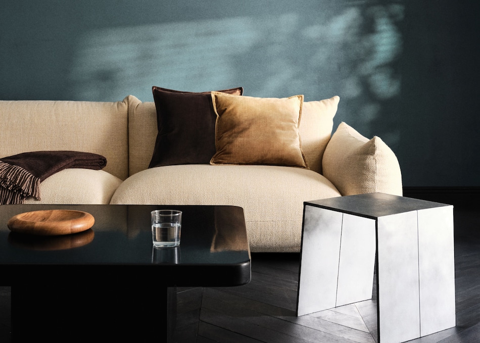 Combine cushions with beige sofa.