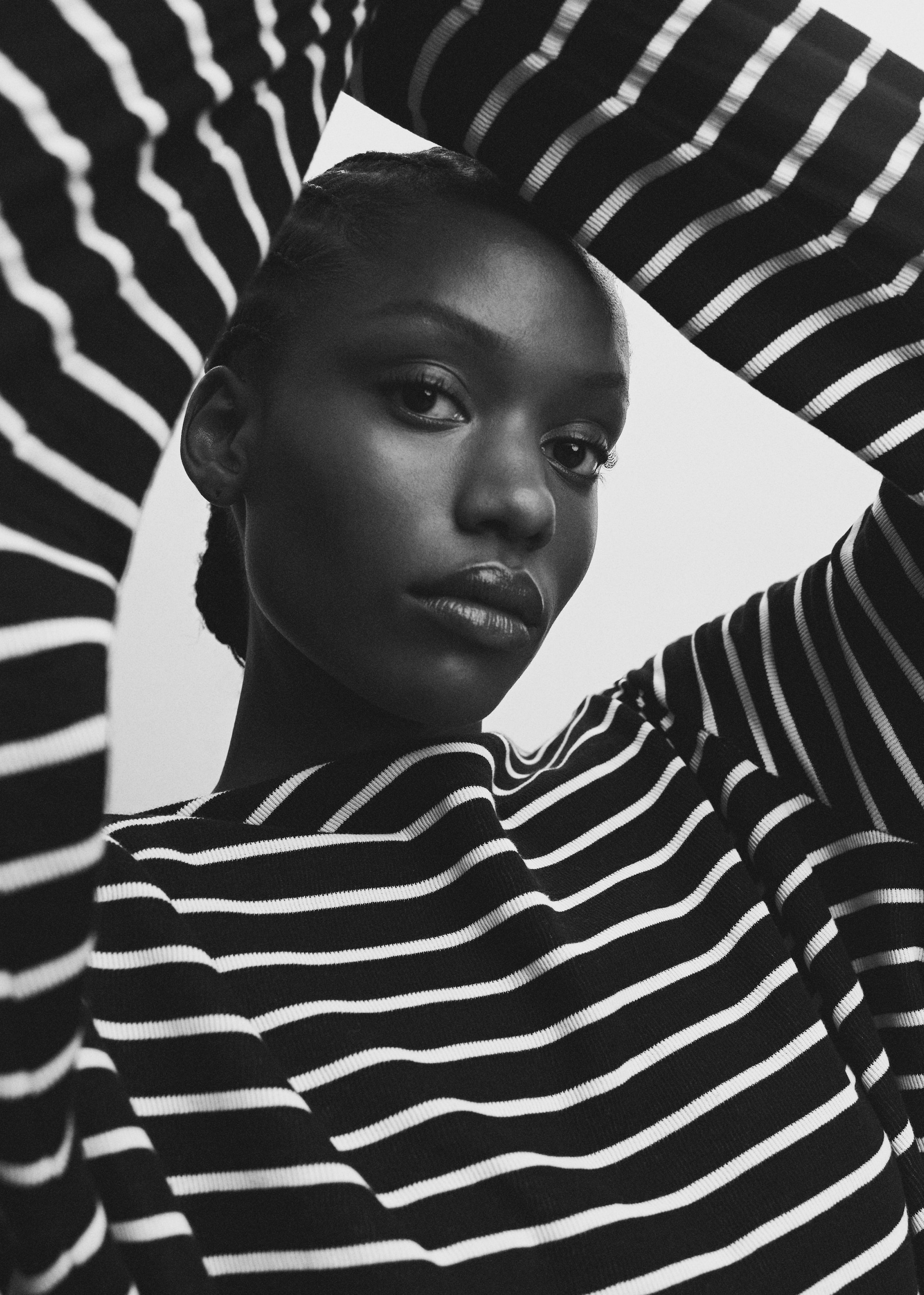 Woman wearing a black and white striped jumper