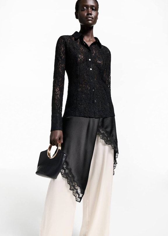 A Thanksgiving outfit for women with a black lace blouse.