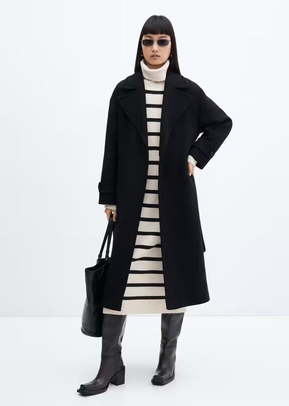 Woman wearing a long knitted dress look for winter.